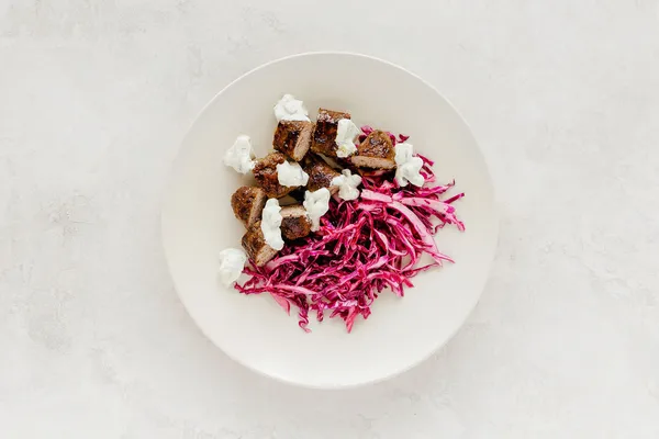 Lamb with purple cabbage and yogurt